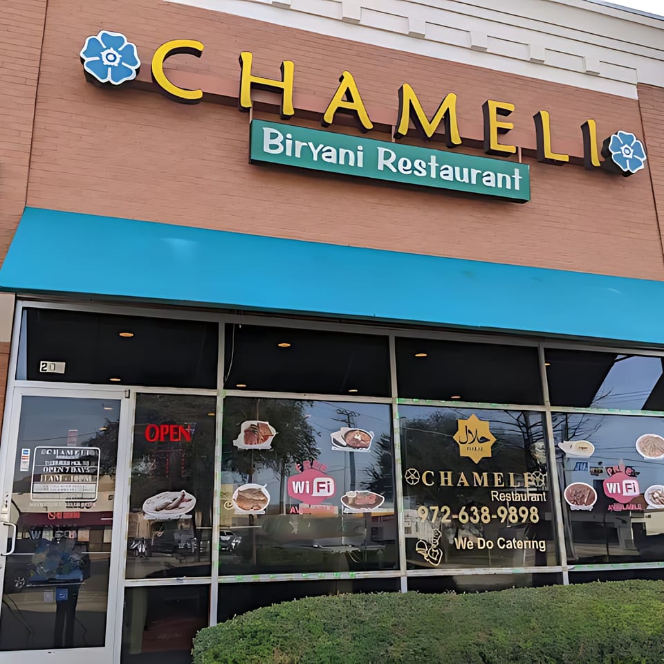 Chameli Biryani Restaurant storefront with a blue awning, large windows, and an "OPEN" sign.