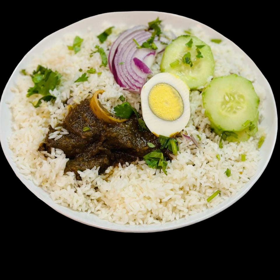 Chameli Restaurant's Bangladeshi dish with rice, dark curry, sliced egg, red onion, and cucumber.
